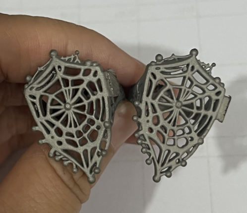 Two stainless steel jewelry casting blanks with openwork details
