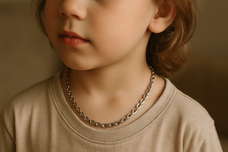 Child wearing hypoallergenic stainless steel jewelry.